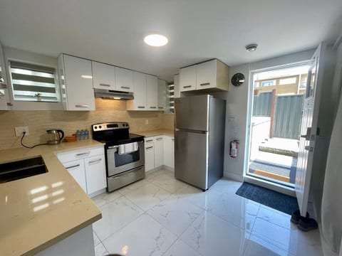 Ground level suite with just one step down for easy access. Full Kitchen with Fridge, freezer, Stove, Oven, Electric Kettle & Microwave, cookware, plates & cutlery.