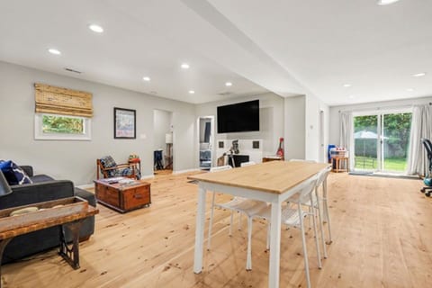Open-concept kitchen, dining, and living room.