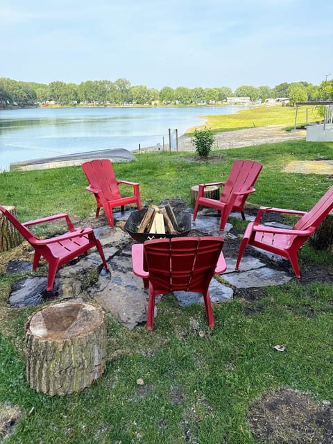 Funky Island - Relax by the fire pit just steps from the sandy beach and swimming area.