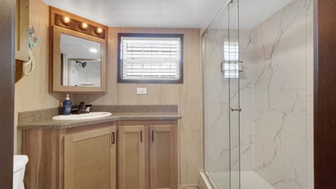 Modern bathroom featuring a walk-in shower.