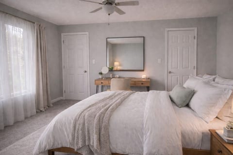 Bedroom with King Bed and Desk with Chair