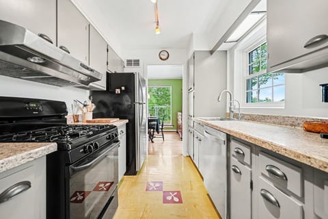 Bright, fully equipped kitchen with a cozy breakfast table. The perfect spot for morning coffee, quick meals, or keeping the cook company.