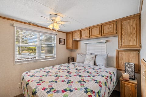 Relaxing bedroom with warm interiors and cozy furnishings, perfect for a restful stay.