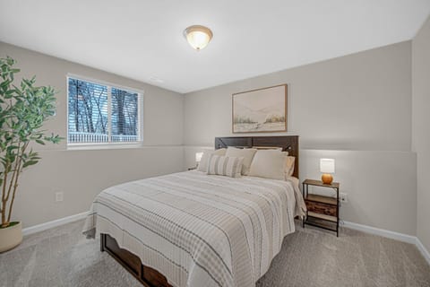 Comfortable guest bedroom with a cozy sleeping space.