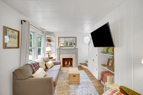 Living room with fire place and smart tv. 