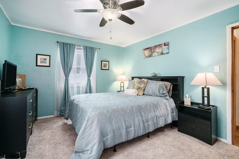 This Beautiful Primary Bedroom has a Queen size bed and a nice little vanity/desk.