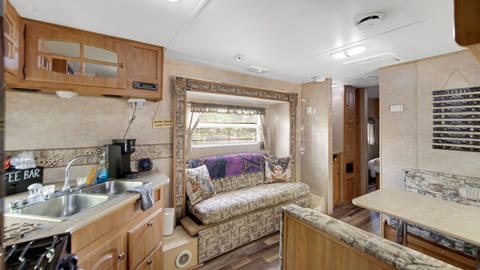 Comfortable seating in the living area, ideal for relaxing after a day at the campground.