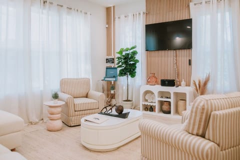 Comfortable living room perfect for socializing, singing, board games (stored in the couch) or just watching Roku TV. Mississippi inspired artwork on the walls and thought-provoking decorations throughout.