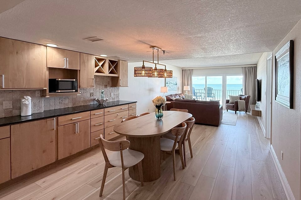 Open-concept living with stylish dining area and stunning ocean-view balcony