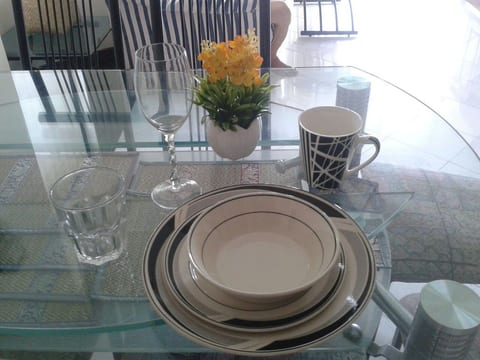 Cutleries and pots and pans complete the kitchen