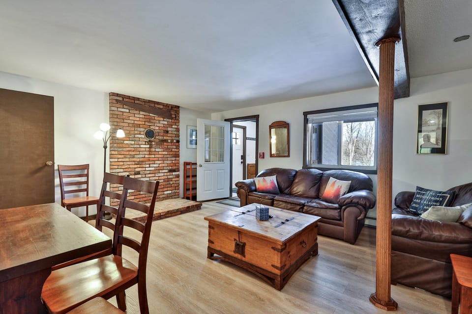 Leather seating and a nearby dining table give the group one place to eat, talk and spend time together.
