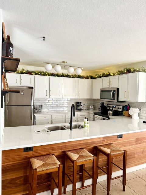 Renovated kitchen with bar stool seating