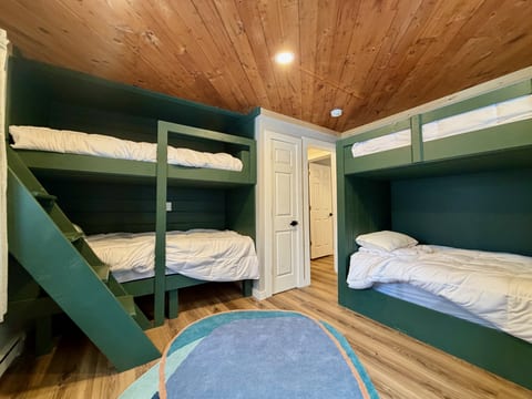 Bedroom 3 has two twin-over-twin bunk sets, with sleeping space for four.