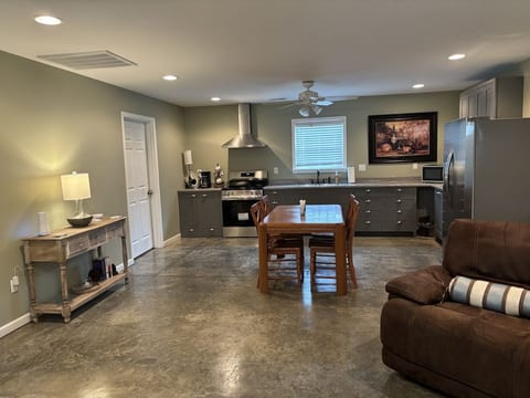 This kitchen is equipped with a brand new stove, microwave and refrigerator.