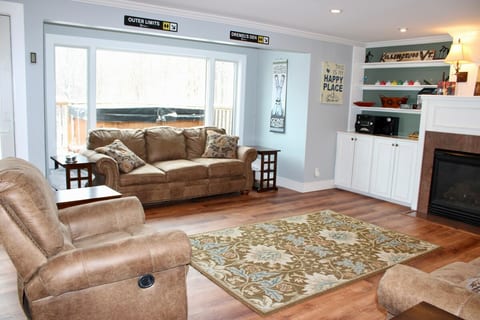 Choose a sofa by the windows, with the gas fireplace beside the seating area.