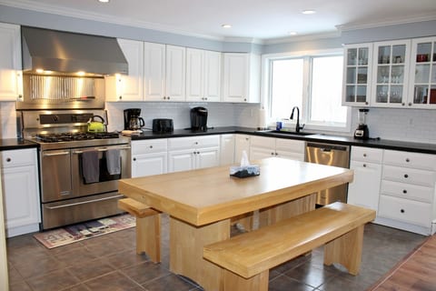 Cook in the full kitchen and bring meals straight to the table beside it.