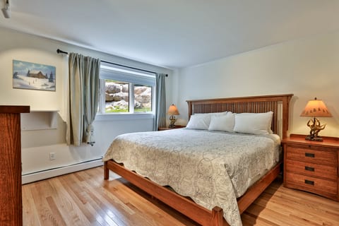 The bedroom has a king bed, separate from the living room's sofa beds.