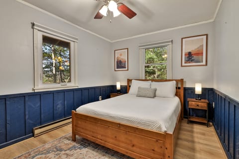 Turn in for the night in this queen bedroom, with a bedside lamp on either side.