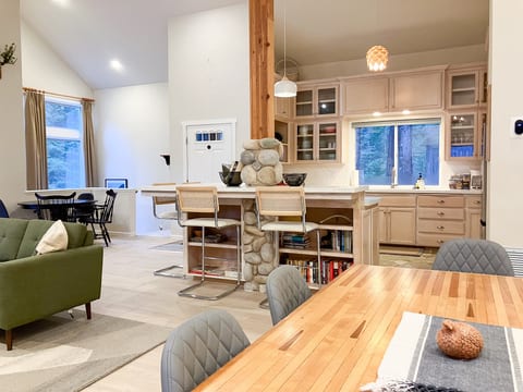 Gather for meals at the vintage bowling alley dining table or pull up a stool at the kitchen island.