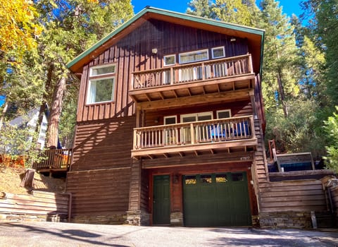 Boom Chalet nestled among towering trees in Sugar Pine.