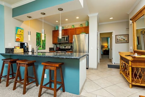 Fully stocked eat-in kitchen with pots and pans, spices, and all the essentials.