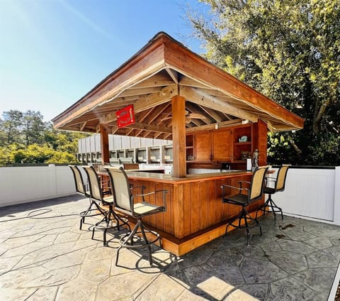 Tike Bar in the Pool Area, wet bar, fridge, seating and more