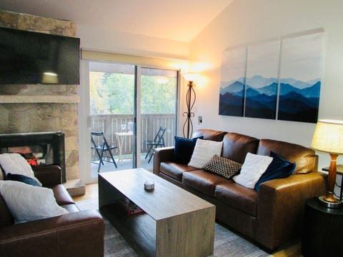 Private balcony with Eagle river view, sofa sleeper, Netflix and Hulu, and electric fireplace