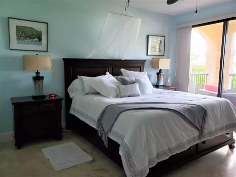 Enjoy the view of the beach from the king size bed in the master bedroom.