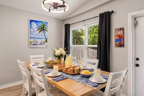 Sandwiches piled high, a pitcher of lemonade catching the light — pull up a chair, because this table was built for a crowd that likes to eat together.