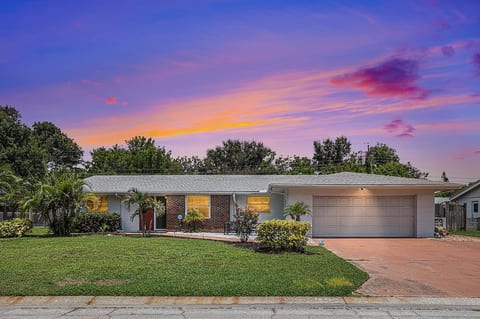 Exterior: Vibrant sunsets and lush greenery await you in this stunning Bradenton retreat!