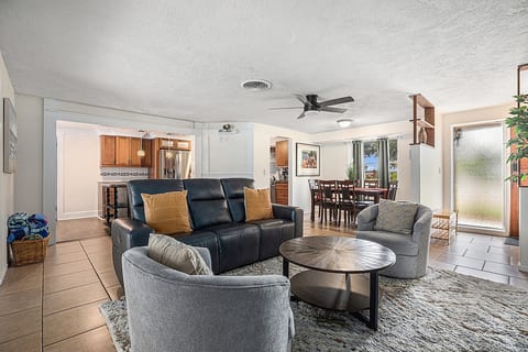 Living room with leather sofa, chairs and coffee table