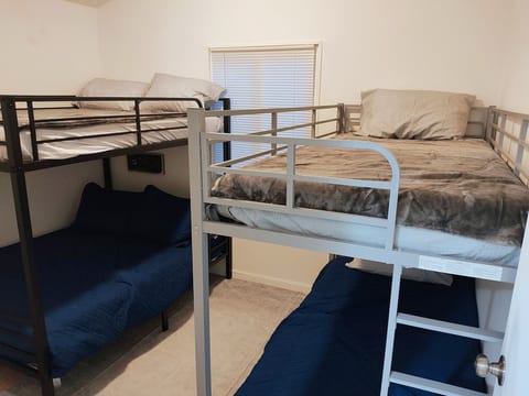 Bunk Room:
Perfect for families and groups! This upstairs bunk room features a full-over-full bunk bed, twin-over-twin bunk bed, and a 32" Roku TV for streaming and relaxing after a day at the lake.
