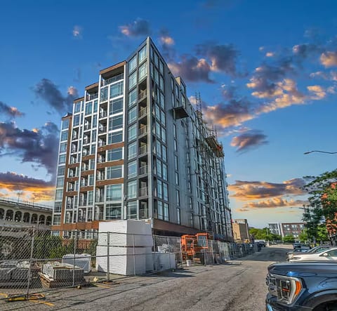 Modern city-view building with sleek design and sunset ambiance