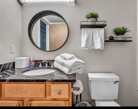 Bright, stylish bathroom with plush towels and modern touches