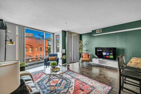 Bright, stylish living room with city views and smart TV