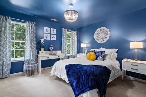 this is the Blue Room. The Decour is inspired by grand millennial chinoiserie. Daylight above is a remote controlled fandelier for climate comfort.
