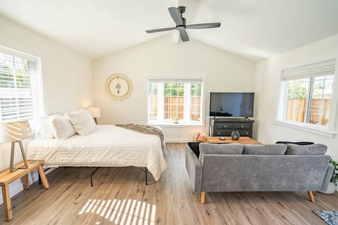 Smart tv and queen bed.