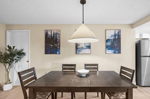 Dining area with seating for seven conveniently located just off the kitchenette for easy meals and gathering.