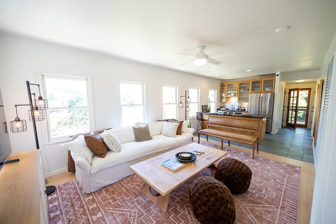 Bright and comfortable living space designed for relaxing after a day in Napa. Smart TV and large sofa couch and bench. Board games included for a night in.