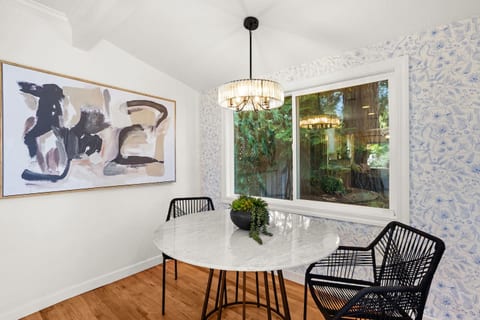 Dining area with stylish seating, natural light, and the perfect space to gather for meals, coffee, or wine nights.
