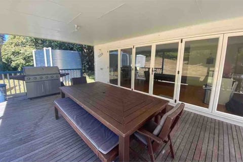 Large outdoor family table with bbq