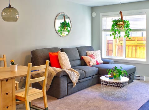 Living room and dining room. Couch converts to a queen bed, relax w/ a book, puzzle or game, watch Netflix or drift off for a nap. 