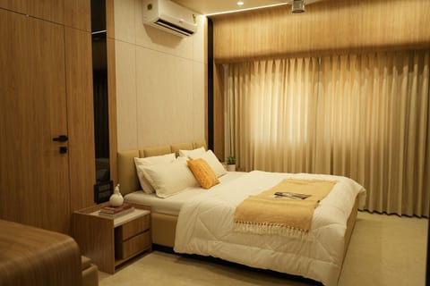 Spacious bedroom with a plush queen-size bed.