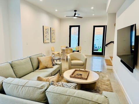 Cozy sofa with area rug and polished concrete floors, 10' ceilings.