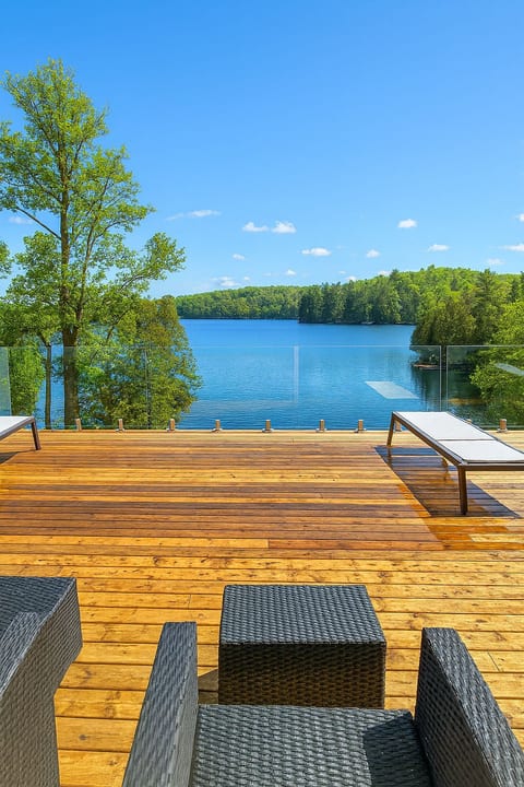 Expansive deck with lake views designed for groups to relax together.