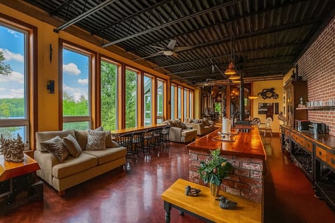 Entertainer’s kitchen and dining space for shared meals and connection. With unobstructed lake views, this eat-in kitchen is designed for large groups and is fully stocked & equipped.