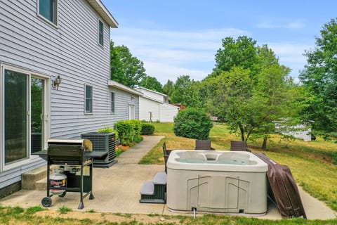 Outdoor Escape: Unwind in the hot tub or fire up the grill amid serene natural beauty!