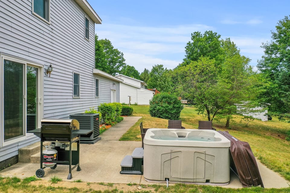 Outdoor Escape: Unwind in the hot tub or fire up the grill amid serene natural beauty!