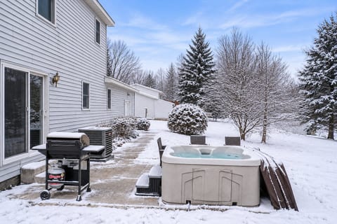 Outdoor Escape: Unwind in the hot tub or fire up the grill amid serene natural beauty!
