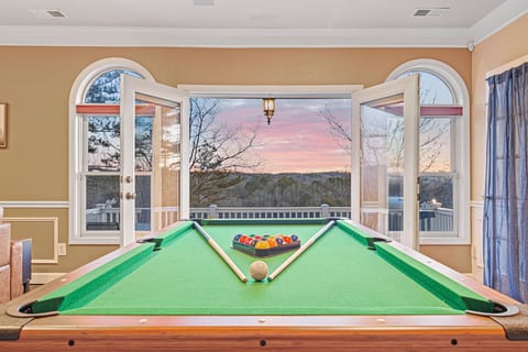 Game Room: Rack up fun with stunning sunset views as you challenge friends to a match!